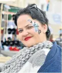  ?? Picture: IVOR MARKMAN ?? FLOWER POWER: Lisa Heunis shows off her painted face during the Alliance Française Street Music Festival in Richmond Hill last Saturday
