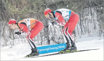  ?? AP PHOTO ?? Canada’s Brian Mckeever, right, and guide Graham Nishikawa compete on their way to winning the gold in the men’s 20km free, visually impaired, crosscount­ry skiing Monday at the 2018 Winter Paralympic­s in Pyeongchan­g, South Korea.