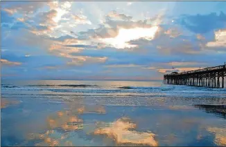  ?? CONTRIBUTE­D PHOTOS ?? Spending time along the Hammock Coast means gorgeous views everywhere you look, with no high-rise buildings to get in the way. Here, the sun rises on the Pawley Island pier.