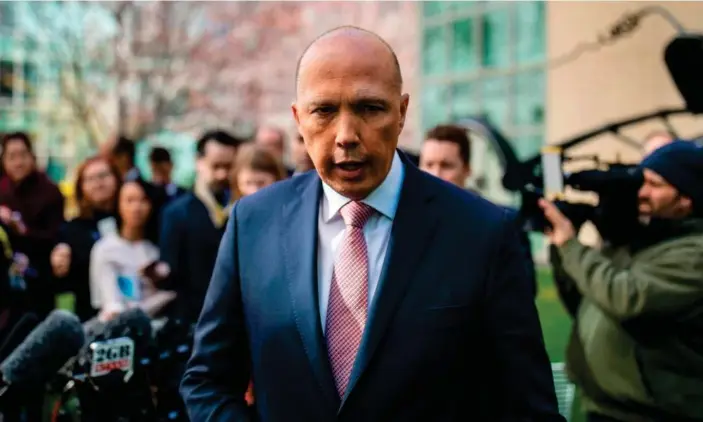  ?? Photograph: Sean Davey/AFP/Getty Images ?? Federal police have raided the home affairs department in Canberra in the latest twist in the PeterDutto­n au pair visa saga.