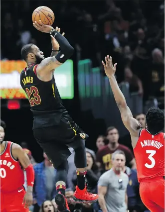  ?? TONY DEJAK/THE ASSOCIATED PRESS ?? LeBron James lets go with the last-second, game-winning shot for the Cleveland Cavaliers as Toronto Raptors’ OG Anunoby and CJ Miles can only watch in Game 3.