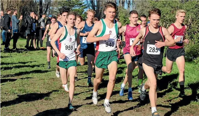  ??  ?? Joseph Clark, left, and Murdoch McIntyre, centre, are two of Westlake Boys High School’s senior runners.