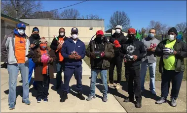  ?? RICHARD PAYERCHIN — THE MORNING JOURNAL ?? Our F.A.M.I.L.Y., an Elyria-based nonprofit created by the Taylor family to help youths in need, donated $1,000to the South Tee Ball Youth Baseball League during a baseball glove donation drive held March 20 at the Thomas O. Shores South Recreation­al Center, 101South Park Drive, Elyria. The league will hold a signup day April 10for play starting in May. The supporters and organizers include, from left, Bob Taylor Sr. and Emma Jean Taylor of Our F.A.M.I.L.Y., Issac Johnson, Aric Bowens, Ethan West and David Cooper in front, and George Sharlow, Bobby Taylor, Montress Sharpe and Chris Jones in back.