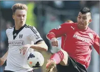  ??  ?? LESSER SPOTTED: Cauley Woodrow, left, playing for parent club Fulham last year, has made just two substitute appearance­s for Barnsley.
