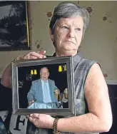  ??  ?? Janet Docherty holds a picture of husband Frank, who lived at Smyllum, right.