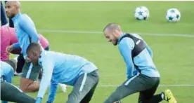  ?? — AFP ?? ROTTERDAM: Manchester City’s Spanish midfielder David Silva (R) takes part in a training session at the City Football Academy in Manchester, northwest England yesterday on the eve of their UEFA Champions League Group F football match against Feyenoord...