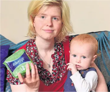  ??  ?? SANITARY PRODUCTS NIGHTMARE Shauna Gauntlett with her one-year-old son Jacob. Picture: Paul Chappells