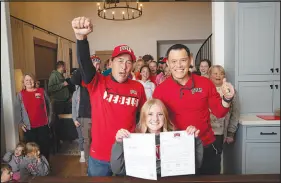  ?? STEVE MARCUS ?? Leah Okuda, a cross country and track runner for Shadow Ridge High School, poses with her granfather Gerry, left, and father, Cody, after signing a letter of intent to run for UNLV during a ceremony Jan. 12 at her home. Gerry Okuda played baseball for UNLV in 1975-1976. Her father played baseball for UNLV in 1999-2000. The Okudas are the first three-generation family of student-athletes at UNLV.