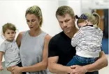  ?? GETTY IMAGES ?? David Warner and his wife Candice arrive back in Sydney after the Australian test player was sent home for his role in the ball tampering scandal.