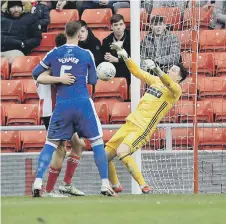  ??  ?? Jon McLaughlin makes a vital save at the Stadium of Light. Picture: Frank Reid