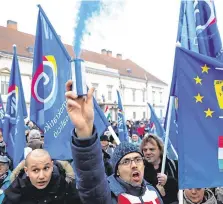  ?? PHOTO: BERNADETT SZABO/REUTERS ?? Protesters in Budapest make their voices heard after Hungarian Prime Minister Viktor Orban delivered his annual state of the nation address.