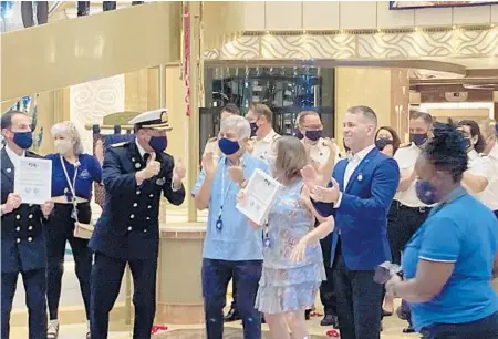  ?? RICHARD TRIBOU/ORLANDO SENTINEL ?? Rick and Sandy Janus, of Clermont, are the first passengers to board Princess Cruises’ Enchanted Princess, which was sailing with passengers for the first time from Port Everglades on Wednesday.