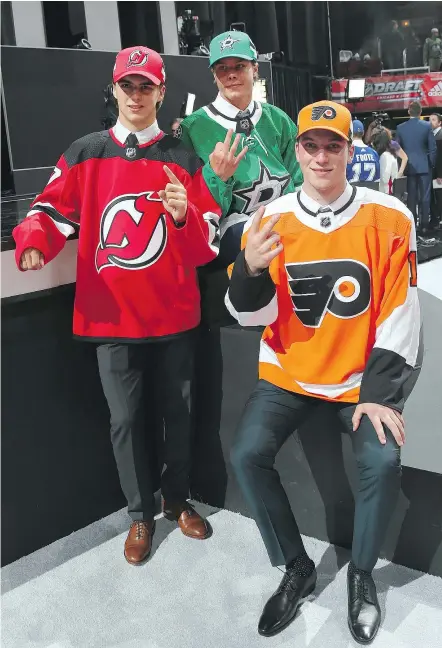  ?? — GETTY IMAGES ?? Nico Hischier, Miro Heiskanen, and Nolan Patrick pose after being selected with the first three picks by New Jersey, Dallas and Philadelph­ia during the 2017 NHL Entry Draft on Friday night.