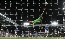  ?? Photograph: Scott Heppell/Reuters ?? Miguel Almirón’s shot finds the top corner of Jordan Pickford’s net to give Newcastle a 1-0 home victory against Everton.