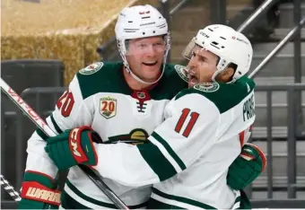  ?? GETTY IMAGES FILE ?? POSSIBLE FUTURE? Minnesota’s Ryan Suter, left, and Zach Parise celebrate after Suter assisted on Parise’s goal against the Vegas Golden Knights in Game 7 of their first-round playoff series on May 28.