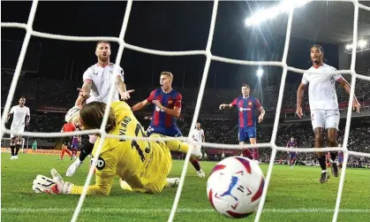  ?? ?? Sevilla's Sergio Ramos reacts to scoring the decisive own-goal against Barcelona Photograph: Pau Barrena/AFP/Getty Images