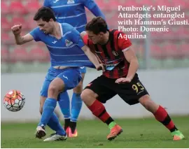  ??  ?? Pembroke’s Miguel Attardgets entangled with Hamrun’s Giusti. Photo: Domenic Aquilina