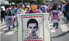  ?? Photograph: Isaac Esquivel/EPA ?? People protest in Mexico City in June over students’ disappeara­nce. The banner reads ‘They took them away alive. We want them alive.’