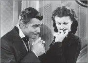  ?? HULTON ARCHIVE ?? Clark Gable, left, as Rhett Butler and Vivien Leigh as Scarlett O’Hara in “Gone With the Wind.”