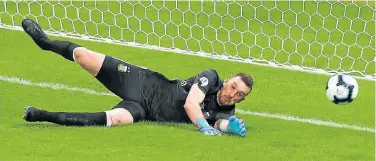  ?? PHOTOS: AP / RICARDO MAZALAN ?? Franco Armani saves a penalty as Argentina continues to struggles.