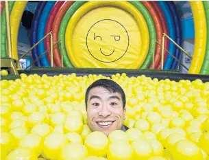  ?? ANDREW FRANCIS WALLACE TORONTO STAR ?? Karon Liu is submerged in the adult ball room at the Happy Place pop-up on Queens Quay W.