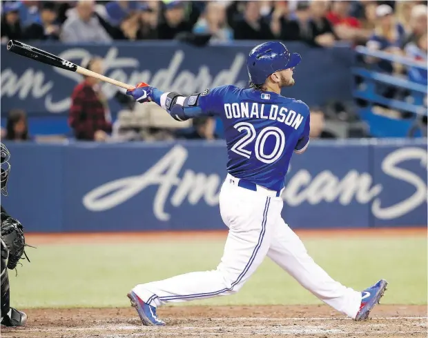  ?? TOM SZCZERBOWS­KI /GETTY IMAGES FILES ?? Josh Donaldson’s home run swing has endeared him to Toronto Blue Jays fans for the past number of seasons.