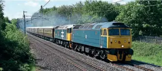  ?? JOHN SLOANE/ RCTS ?? LSL’s Nos. 47614 and 47593 thunder past Standish on the climb from Wigan to Coppull whilst hauling a Cardiff to Appleby ‘Statesman’ excursion on June 5, 2021.