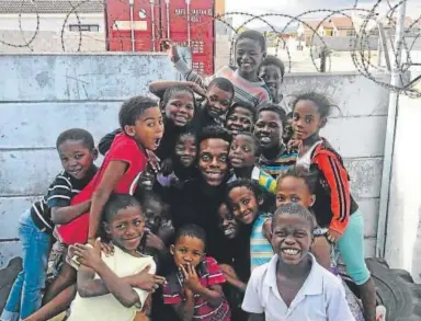  ??  ?? Broncos linebacker Brandon Marshall said he had a humbling experience at an orphanage in Cape Town, South Africa, but was glad that NFL players could give back and leave the children with smiles on their faces.