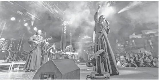  ?? Associated Press photos ?? Siervas performs at the Festival de Cristo at Christ Cathedral in Garden Grove, Calif. The band gained an internatio­nal following after its debut three years ago.