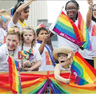  ?? GAVIN YOUNG/FILES ?? Calgarians take part in the Pride Parade last year. There are more than 190 entries this year.