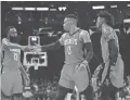  ??  ?? The Rockets’ James Harden (13) Russell Westbrook (0) and Robert Covington (33) celebrate a win.