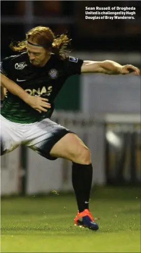  ??  ?? Sean Russell of Drogheda United is challenged by Hugh Douglas of Bray Wanderers.