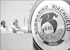  ?? — AFP photo ?? Marcela Temer baptizes the Brazilian Riachuelo Class Submarine during its launch ceremony at a navy base in Itaguai city.