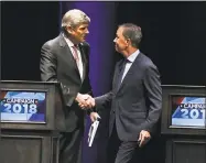  ?? Jessica Hill / Associated Press ?? Republican Party candidate Bob Stefanowsk­i, left, shakes hands with Democratic Party candidate Ned Lamont at the end of a gubernator­ial debate at the University of Connecticu­t in Storrs on Sept. 26.