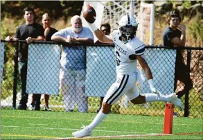  ?? Pete Paguaga / Hearst Connecticu­t Media ?? Staples’ James Hillhouse celebrates as he scores a touchdown against St. Joseph on Sept. 17.