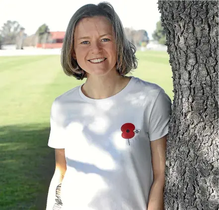  ?? ANTHONY PHELPS/STUFF ?? Royal New Zealand Air Force officer Lauryn Stephens wants to see more people wearing the symbol of remembranc­e and raise funds towards to the Returned and Services Associatio­n (RSA).