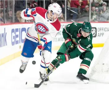  ?? PHOTO USA TODAY ?? Jonathan Drouin et Mikko Koivu bataillent pour la possession de la rondelle.