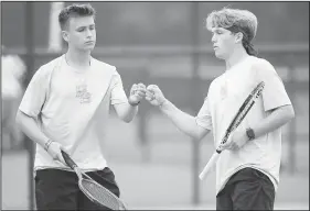  ?? NWA Democrat-Gazette/ANDY SHUPE ?? Har-Ber’s Hayden Swope (left) and Conor Clardy celebrate a point Tuesday during their match with Little Rock Central’s Phillip Abston and Zandy Djurica during the Class 6A state tennis championsh­ip at Har-Ber High School in Springdale.