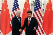  ?? Lintao Zhang / Getty Images ?? Chinese President Xi Jinping, right, shakes hands with then-u.s Vice President Joe Biden on Dec. 4, 2013, inside the Great Hall of the People in Beijing. Xi and Biden meet for their first presidenti­al meeting Monday.