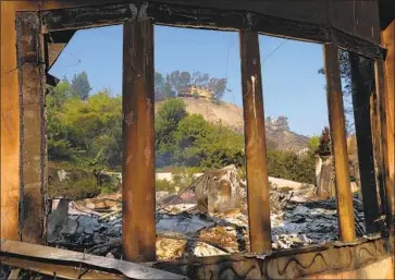  ?? Mel Melcon Los Angeles Times ?? THE SHELL of a home on Bell Canyon Boulevard is all that is left after the wrath of the Woolsey fire.