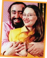  ??  ?? Big hug: Pavarotti and his companion Nicoletta Mantovani