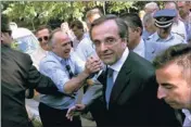  ?? By Louisa Gouliamaki, Afp/getty Images ?? Tough job ahead: New Democracy leader Antonis Samaras arrives at the prime minister’s offices in Athens.