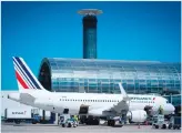  ??  ?? This file photo shows an Air France plane parked on the tarmac of RoissyChar­les de Gaulle Airport, north of Paris. Air France management and unions on Oct 19, reached a deal to end months of strikes that set the airline back hundreds of millions ofeuros. (AFP)