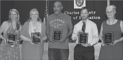  ?? SUBMITTED PHOTO ?? The Board of Education honored outstandin­g Charles County Public Schools staff at its June meeting. Among those received accolades are Shelley Mackey, a communicat­ions specialist at the Jesse L. Starkey Administra­tion Building, left; Sharon Bautista, data technician at La Plata High School; Clifton Shorter, the building service manager at Mattawoman Middle School; Justin Lucchesi, a computer specialist II at Henry E. Lackey High School; and Anne Zabel, a prekinderg­arten instructio­nal aide at C. Paul Barnhart Elementary School.