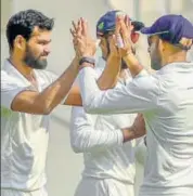  ?? PTI ?? Aditya Sarwate (left) celebrates with Vidarbha teammates after dismissing a Saurashtra batsman in the Ranji Trophy final.