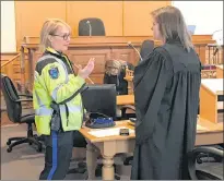  ?? TARA BRADBURY/THE TELEGRAM ?? RNC Const. Karen Didham (left), a collision analyst, speaks with Crown prosecutor Jennifer Lundrigan during a break in the trial of Joshua Steeleyoun­g in Newfoundla­nd and Labrador Supreme Court in St. John’s Thursday. Steele-young, 23, is charged in connection with a car crash that left his ex-girlfriend paralyzed from the chest down.