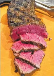  ?? ELIZABETH KARMEL VIA THE ASSOCIATED PRESS ?? This beef tenderloin was given a gentle sous vide cooking before being seared on a grill