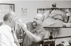  ?? Kirk Sides ?? Paramedic Rob Koonce performs a throat examinatio­n during a demonstrat­ion of telemedici­ne technology.