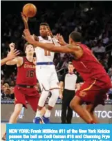  ??  ?? NEW YORK: Frank Ntilikina #11 of the New York Knicks passes the ball as Cedi Osman #16 and Channing Frye #8 of the Cleveland Cavaliers defend at Madison Square Garden in New York City. — AFP