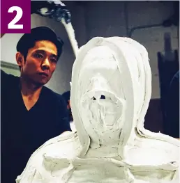  ??  ?? Shaping up: Special effects genius Tsuji then covers the mould with a plaster compound to create a bust